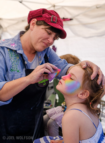 Because of the faces and gestures I really wanted to use black and white but the color of the face painting and painter’s hat and clothing were just too much a part of the story to not use color. I used the Astia film simulation on the RAF (raw) file in Lightroom. This time I set the 23mm to f2.8 for shallow depth of field. 1/3200 sec. ISO 400.