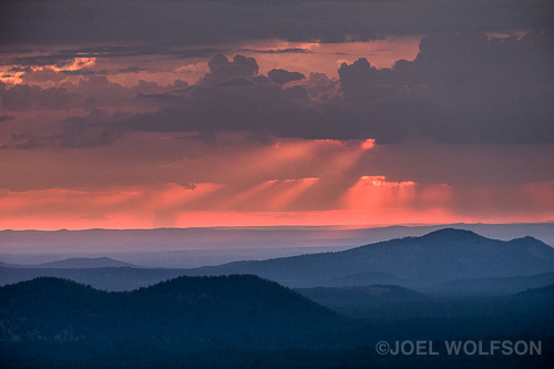 I like shooting in northern Arizona during monsoon season because there are invariably interesting and dramatic skies. This vantage point is in the San Francisco Peaks around 10 or 11 thousand feet (approx 3500m) This is mostly about layering and tonality. The color from the sunset was just a bonus